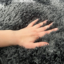 Load image into Gallery viewer, Close up photo of a hand in the shaggy relax mat pushing down into the fibres - Muscle Mat Deluxe Shaggy Relax Mat which is Best Shaggy Relax Mat of Australia.
